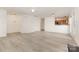 Open-concept living room showcasing fresh neutral paint and new laminate floors at 9664 Littleleaf Dr, Charlotte, NC 28215
