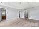 Bright bedroom features multiple doors, plush carpet and neutral paint at 9728 Blossom Hill Dr, Huntersville, NC 28078