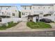 Charming townhome with attached garage, a well-maintained lawn, and a private driveway at 9728 Blossom Hill Dr, Huntersville, NC 28078