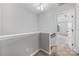 Upstairs hallway shows access to the bedrooms and a carpeted floor at 9728 Blossom Hill Dr, Huntersville, NC 28078