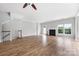 Bright living room with hardwood floors, fireplace, and plenty of natural light at 9728 Blossom Hill Dr, Huntersville, NC 28078