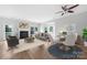 Bright living room features a fireplace, bay window, and an adjacent dining area, great for entertaining at 9728 Blossom Hill Dr, Huntersville, NC 28078
