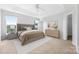 Cozy bedroom with tray ceiling, fan, neutral colors, and large windows to let in lots of light at 9728 Blossom Hill Dr, Huntersville, NC 28078
