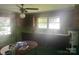 Functional kitchen features vintage cabinets and lots of natural light at 10010 Stokes Ferry Rd, Gold Hill, NC 28071
