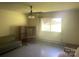 Well-lit living room with a ceiling fan and lots of natural light at 10010 Stokes Ferry Rd, Gold Hill, NC 28071