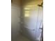 A white shower stall with built in shelves and safety bars at 10010 Stokes Ferry Rd, Gold Hill, NC 28071