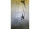 A white shower with built-in shelving and safety bars at 10010 Stokes Ferry Rd, Gold Hill, NC 28071