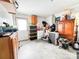 Unfinished basement provides ample storage space with various containers, cabinets, and a mini fridge at 103 Little Forest Ln, Statesville, NC 28625