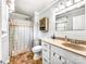 Compact bathroom with shower-tub combo, vanity with sink, and neutral color scheme, maximizing space at 103 Little Forest Ln, Statesville, NC 28625