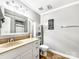 A well-lit bathroom with neutral colors, modern fixtures, and ample storage offers comfort and functionality at 103 Little Forest Ln, Statesville, NC 28625