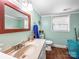 Cozy bathroom featuring tiled floors, blue walls, a granite sink and toilet at 103 Little Forest Ln, Statesville, NC 28625