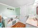Charming bathroom with tile floors, a bathtub, white tiled walls and mint green paint at 103 Little Forest Ln, Statesville, NC 28625