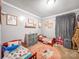 Bright bedroom featuring carpeted floors, twin beds, ' toys, and natural lighting at 103 Little Forest Ln, Statesville, NC 28625