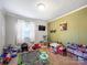 Comfortable bedroom featuring a playful rug and entertainment area at 103 Little Forest Ln, Statesville, NC 28625