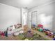 Bright bedroom featuring plush seating, ' toys, carpeted floors, and natural lighting at 103 Little Forest Ln, Statesville, NC 28625