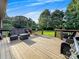Spacious wooden deck with outdoor seating, perfect for enjoying the serene and private backyard setting at 103 Little Forest Ln, Statesville, NC 28625