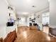 Cozy kitchen with white cabinets, modern appliances, and adjacent dining area at 103 Little Forest Ln, Statesville, NC 28625