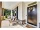 Inviting front porch with stone accents, wicker seating, and a stylish black front door at 111 Summerhill Dr # 2, Mooresville, NC 28115