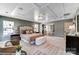 Bright main bedroom with tray ceiling, light carpet, and access to an expansive walk-in closet at 111 Summerhill Dr # 2, Mooresville, NC 28115