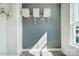 This walk-in closet boasts ample storage space with shelving and hanging racks with light from a window at 111 Summerhill Dr # 2, Mooresville, NC 28115