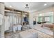 Well-organized walk-in closet with custom shelving, drawers, seating, and stylish design overlooking main bedroom at 111 Summerhill Dr # 2, Mooresville, NC 28115