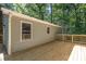 Spacious wooden deck with a wooden railing, perfect for outdoor entertaining at 1118 Brookwood Dr, Stanley, NC 28164