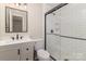 Bathroom with modern fixtures including a glass enclosed shower and updated vanity at 1118 Brookwood Dr, Stanley, NC 28164