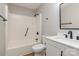 Renovated bathroom featuring a tub, shower combo, modern vanity and new fixtures at 1118 Brookwood Dr, Stanley, NC 28164