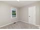 Bedroom features neutral walls, carpet, and a window offering outdoor views at 1118 Brookwood Dr, Stanley, NC 28164