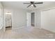 Carpeted bedroom with attached bathroom and closet offers ample space and convenience at 1118 Brookwood Dr, Stanley, NC 28164