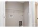 Well-lit laundry room with shelving and utility connections at 1118 Brookwood Dr, Stanley, NC 28164