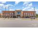 Exterior view of Stanley Middle School, showing the front facade and parking lot at 1118 Brookwood Dr, Stanley, NC 28164
