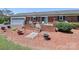 Brick patio with a ramp, table, potted plants, and a well-manicured lawn at 116 Deer Trail Rd, Statesville, NC 28677