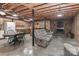 Finished basement featuring a kitchenette, stone fireplace, and a cozy living space at 116 Deer Trail Rd, Statesville, NC 28677