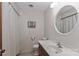 Clean bathroom featuring a shower with curtain, mirror, and toilet providing essential amenities at 116 Deer Trail Rd, Statesville, NC 28677