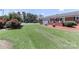 Brick home with attached garage and front yard with well-kept landscaping at 116 Deer Trail Rd, Statesville, NC 28677