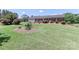 Well-maintained brick home showcasing a lush front yard and attached garage at 116 Deer Trail Rd, Statesville, NC 28677