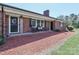 Inviting front porch with seating, brick accents, and a decorative door at 116 Deer Trail Rd, Statesville, NC 28677