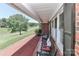 Inviting front porch with seating, offering views of the landscaped yard and surroundings at 116 Deer Trail Rd, Statesville, NC 28677