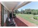Cozy front porch with rocking chairs and pillows, overlooking a spacious yard at 116 Deer Trail Rd, Statesville, NC 28677
