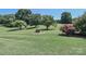 Expansive front yard featuring meticulously maintained landscaping and mature trees at 116 Deer Trail Rd, Statesville, NC 28677