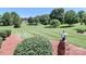 Beautifully landscaped front yard with a brick mailbox post and manicured lawn at 116 Deer Trail Rd, Statesville, NC 28677