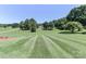 Sprawling front yard with a gentle slope, complemented by mature trees at 116 Deer Trail Rd, Statesville, NC 28677