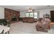 Spacious living room features a cozy brick fireplace and large windows at 116 Deer Trail Rd, Statesville, NC 28677