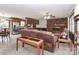 Cozy living room with a brick fireplace, comfortable seating, and an open kitchen area at 116 Deer Trail Rd, Statesville, NC 28677