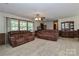 Bright living room with large windows and comfortable sofas at 116 Deer Trail Rd, Statesville, NC 28677