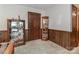 Small, carpeted room with wood paneling, a door, and display cabinets at 116 Deer Trail Rd, Statesville, NC 28677