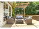 Inviting outdoor space with pergola, patio furniture and view of a grassy backyard at 11624 Crossroads Pl, Concord, NC 28025