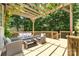 Charming outdoor space featuring a pergola, deck, and comfortable seating for entertaining at 11624 Crossroads Pl, Concord, NC 28025