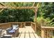 Inviting outdoor deck featuring a pergola and wooded scenery at 11624 Crossroads Pl, Concord, NC 28025